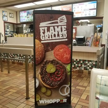 Burger King - a sign in a fast food restaurant - Burgers Near Me - Wadesboro, North Carolina Burger King - a sign in a fast food restaurant - Burgers Near Me - Wadesboro, North Carolina