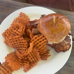 Chicken sandwich with bacon and sweet potato fries