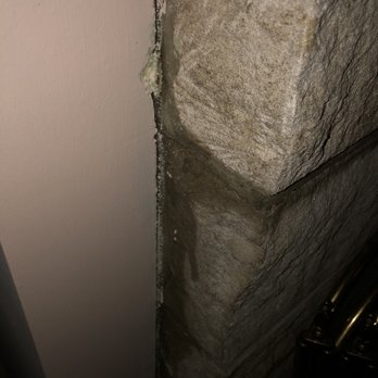 ABIZ Construction - This is the water dripping down from inside my walls. You can see the wet brick. Supposed to have a 30 yr warranty. - Roofing Near Me - Evansville, Indiana ABIZ Construction - This is the water dripping down from inside my walls. You can see the wet brick. Supposed to have a 30 yr warranty. - Roofing Near Me - Evansville, Indiana