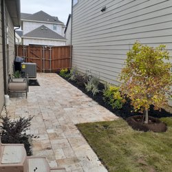 Select Landscaping - Full travertine patio and walkway install. All new trees, shrubs, plants and sod