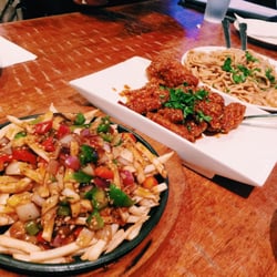 Monkey King Pub & Grub - (L-R) disco fries, Korean wings, garlic noodles