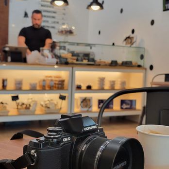 M The Market - a camera and a cup of coffee - Grocery Near Me - Miami, Florida M The Market - a camera and a cup of coffee - Grocery Near Me - Miami, Florida