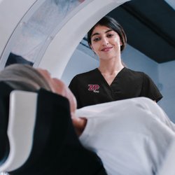 Zwanger-Pesiri Radiology - CT technologist scanning a patient.