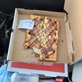 Via 313 Pizza - Large Cadillac pizza with one slice eaten. - Pizza Near Me - Riverton, Utah