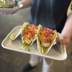 Toqua Bar and Grill - Shrimp Tacos
two flour or corn tortillas (gluten-free corn
tortillas) filled with fresh grilled shrimp,
lettuce, shredded cheese