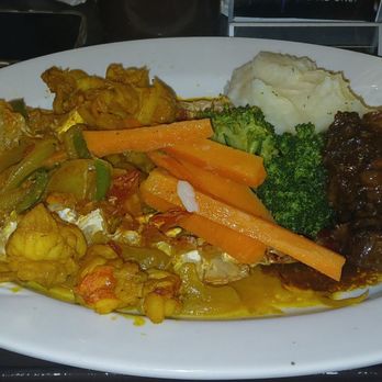 Flava - Curry Lobster Tail with Oxtail and Mash Potatoes with mixed veggies. - Caribbean Near Me - Bronx, New York