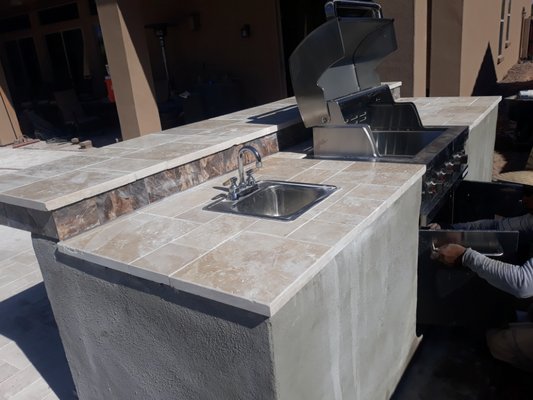 Outdoor Kitchen/Fireplace - Explore our collection of custom outdoor kitchens and firepits, engineered to withstand the elements without compromising on style. Outdoor Kitchen/Fireplace - Explore our collection of custom outdoor kitchens and firepits, engineered to withstand the elements without compromising on style.