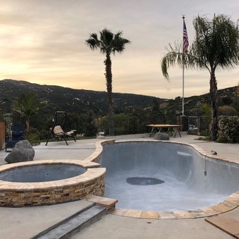 Gardner Outdoor and Pool Remodeling - Pebble on plaster in deep end after rain - Pool & Hot Tub Service Near Me - El Cajon, California