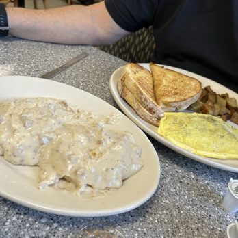 Rosie's Restaurant - Bacon omelet , home fries and sourdough bread. Side of biscuit and gravy - American Near Me - Tamworth, New Hampshire Rosie's Restaurant - Bacon omelet , home fries and sourdough bread. Side of biscuit and gravy - American Near Me - Tamworth, New Hampshire