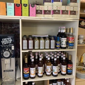 Victoria L'Originale - a shelf full of honeys, jams, and other condiments - Coffee & Tea Near Me - Pompano Beach, Florida