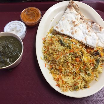 Curry Point Express - This is the "trio", with saag paneer, vegetarian biryani, and two hard pieces of naan. - Indian Near Me - Durham, North Carolina