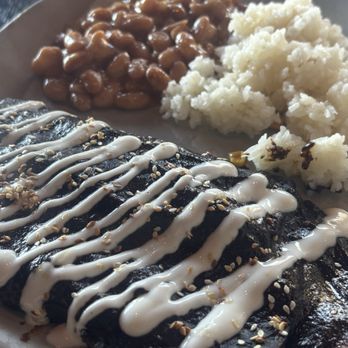 Nómada - CHICKEN ENCHILADAS with Mexican crema and black mole with bean and rice sides - Seafood Near Me - Carlsbad, California