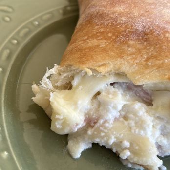 Claudio’s Pizzeria - Calzone with a hair baked into the cheese - Pizza Near Me - Winchester, Virginia