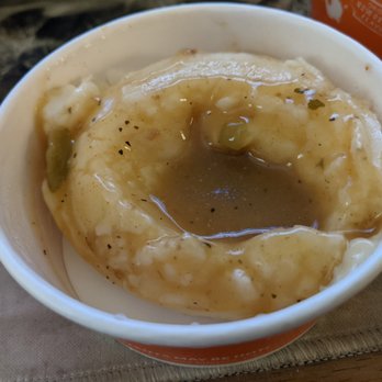 Popeyes Louisiana Kitchen - Mashed potatoes and gravy, which clearly holds a firm shape of whatever it was scooped out with. (see left side) - Fast Food Near Me - Manassas, Virginia