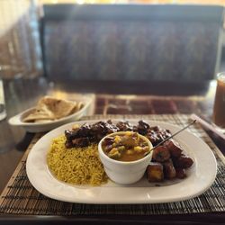 Flavors of East Africa - A delicious meal fit for a foodie: Large Combo, African Jerk Chicken Sweet and Spicy,  Saffron Rice, Nyoyo,  Whole Chapati, Mango Black Tea