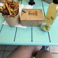 Us Burger U - Fries cooked in beef tallow. The cheeseburger is in the box. The drink is lemonade made with likes, honey, and purified water
