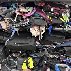 Goodwill Thrift Store & Donation Center - A giant pile of book bags