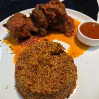 The Continent DC - Red Stew with Chicken and jollof rice - African Near Me - Washington, DC, District of Columbia The Continent DC - Red Stew with Chicken and jollof rice - African Near Me - Washington, DC, District of Columbia