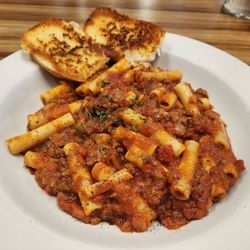American Chop Suey, garlic bread, aka Baked Hamburg and Macaroni, aka Ziti with Meat Sauce. Take your pick.