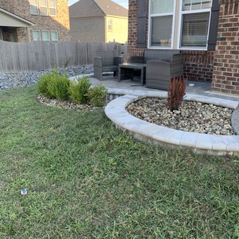 JV Landscape - a backyard with a lawn and a fire hydrant - Lawn Services Near Me