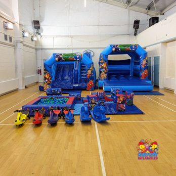 Airplay Inflatables - Superhero themed bouncy castle and soft play package. Features a bouncy castle, inflatable slide, soft play and didi cars. - Bounce House Rentals Near Me - Bexhill, ESX