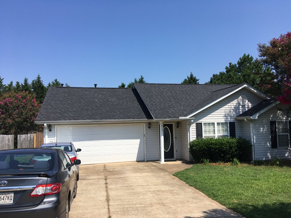 Slide of The Roofing Company