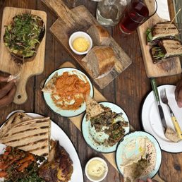 Half chicken plate, avocado toast, dips sampler, fresh sourdough Half chicken plate, avocado toast, dips sampler, fresh sourdough
