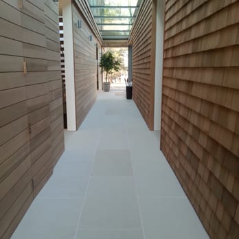 Gem Marble & Granite - a walkway between two buildings - Refinishing Services Near Me - Ronkonkoma, New York