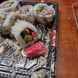 a plate of sushi rolls on a table