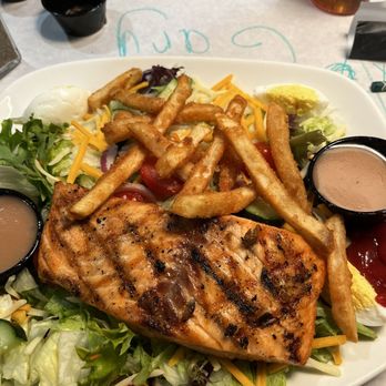 Red River Roadhouse - Griller salad, topped with French fries! Added salmon. So good! - American Near Me - Clarion, Pennsylvania Red River Roadhouse - Griller salad, topped with French fries! Added salmon. So good! - American Near Me - Clarion, Pennsylvania