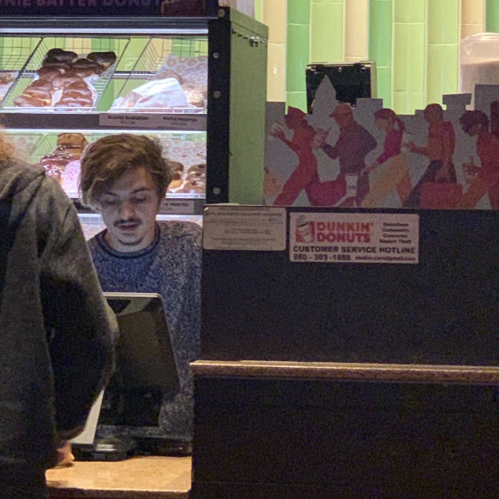 Dunkin' - a man and a woman in a donut shop - Coffee & Tea Near Me - Uncasville, Connecticut Dunkin' - a man and a woman in a donut shop - Coffee & Tea Near Me - Uncasville, Connecticut