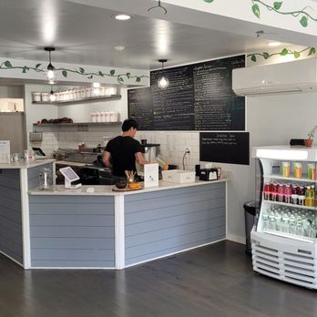 Green Bar - a woman standing at a counter - Juice Bars & Smoothies Near Me - New Paltz, New York Green Bar - a woman standing at a counter - Juice Bars & Smoothies Near Me - New Paltz, New York