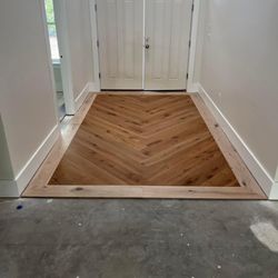 Witt Custom Flooring - Engineered Wood Custom Herringbone inlay glued to the concrete.