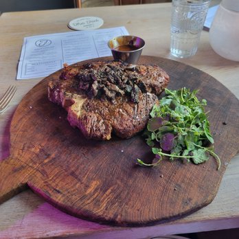 The Fed - 36 oz waygu porterhouse with morel mushrooms and a demi glaze sauce. This steak was amazing and did not require that delicious sauce. - New American Near Me - Clarkston, Michigan