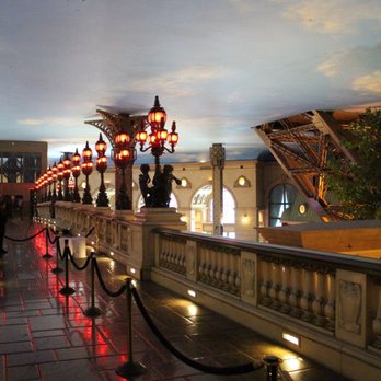 Eiffel Tower Viewing Deck - You get your photo take before you walk across this bridge to get to the elevators - Amusement Parks Near Me - Las Vegas, Nevada Eiffel Tower Viewing Deck - You get your photo take before you walk across this bridge to get to the elevators - Amusement Parks Near Me - Las Vegas, Nevada