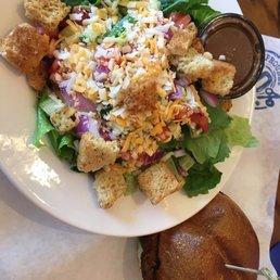 a plate of salad and bread