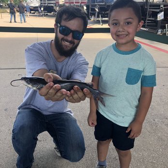 Cabela's - Grandson with his first catfish on the catch and release event. This guy helped to do everything he could to help him catch a fish. - Outdoor Gear Near Me - Fort Worth, Texas