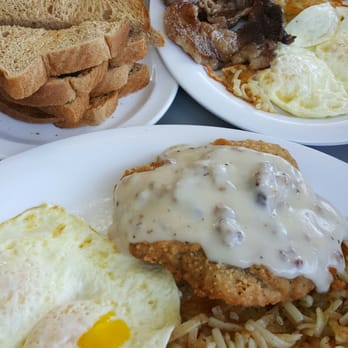 Blue Top Waffle Shoppe - (I broke the yolk before the pic!) Captain"s Plates, with Country Fried Steak and the Ribeye. - Breakfast & Brunch Near Me - Panama City, Florida