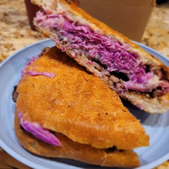 La Bottega - IL Pastrami 1/2 pound of sliced pastrami with whole grain mustard, red cabbage, mustard sauce, and fontina cheese, on ciabatta. - Italian Near Me - West Hempstead, New York La Bottega - IL Pastrami 1/2 pound of sliced pastrami with whole grain mustard, red cabbage, mustard sauce, and fontina cheese, on ciabatta. - Italian Near Me - West Hempstead, New York