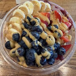 Playa Bowls - Açai bowl with granola, peanut butter, honey, strawberries, blueberries, and bananas