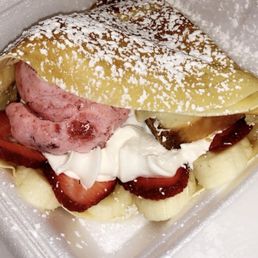 Strawberry Banana Nutella Crepe with strawberry ice cream and cheesecake