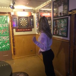 Four Treys Tavern - Susan throwing 3 darts at once