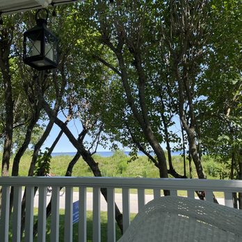 Small Point Bed and Breakfast - Looking out at the water from the front porch. - Bed & Breakfast Near Me - Mackinac Island, Michigan Small Point Bed and Breakfast - Looking out at the water from the front porch. - Bed & Breakfast Near Me - Mackinac Island, Michigan