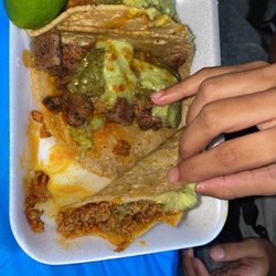 Santo Tacos - It's bomb.  Best tacos so far and handmade tortillas . Fire