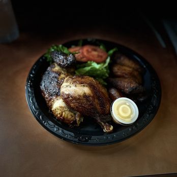 Omi’s Bar & Grill - Delishious chicken with sweet plantines - Salad Near Me - Tampa, Florida