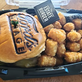 Ford's Garage - The Estate Burger with tater tots - Delivered by my loving husband. - Burgers Near Me - Brandon, Florida Ford's Garage - The Estate Burger with tater tots - Delivered by my loving husband. - Burgers Near Me - Brandon, Florida