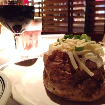 Hillstone - Loaded baked potato with a glass of red wine. - New American Near Me - San Francisco, California Hillstone - Loaded baked potato with a glass of red wine. - New American Near Me - San Francisco, California