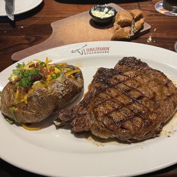 LongHorn Steakhouse - Outlaw Ribeye with loaded baked potato! - Steakhouses Near Me - Norman, Oklahoma LongHorn Steakhouse - Outlaw Ribeye with loaded baked potato! - Steakhouses Near Me - Norman, Oklahoma