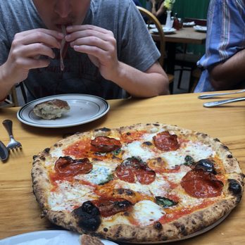 Roberta's - Daniel eating the duck prosciutto & the bee sting pizza - Pizza Near Me - Brooklyn, New York Roberta's - Daniel eating the duck prosciutto & the bee sting pizza - Pizza Near Me - Brooklyn, New York