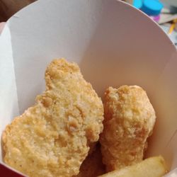 Wendy's - Four Piece Chicken Nuggets and a lonely Fry.